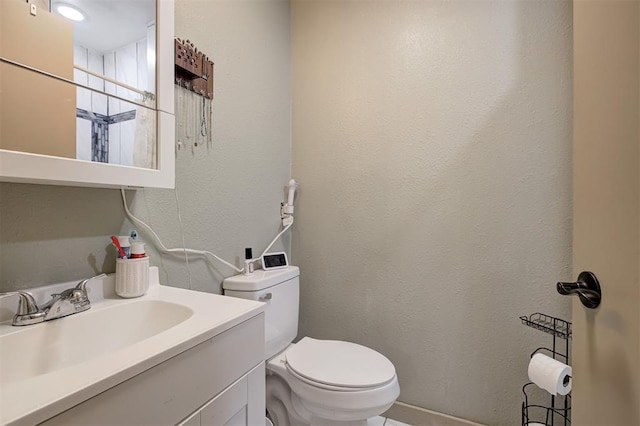 11129 E Thayer St, Midwest City, OK 73130 - bathroom featuring a textured wall and vanity