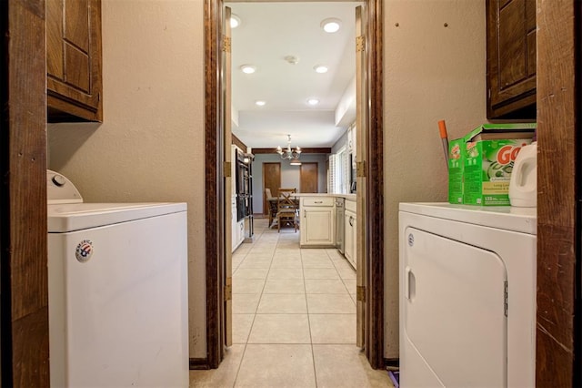 11129 E Thayer St, Midwest City, OK 73130 - laundry area featuring cabinet space, washing machine and clothes dryer, light tile patterned flooring, a chandelier, and recessed lighting