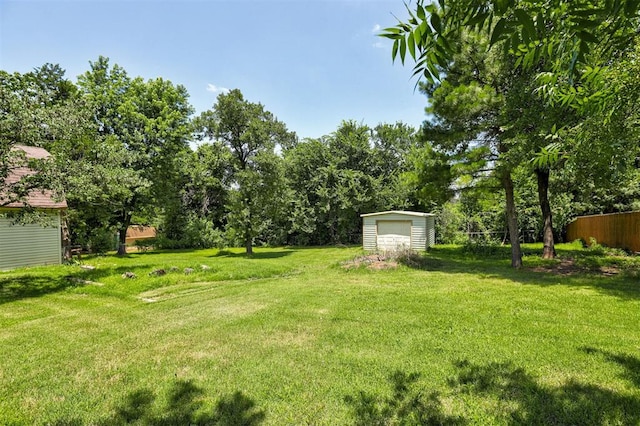 11129 E Thayer St, Midwest City, OK 73130 - view of yard featuring an outdoor structure and a garage