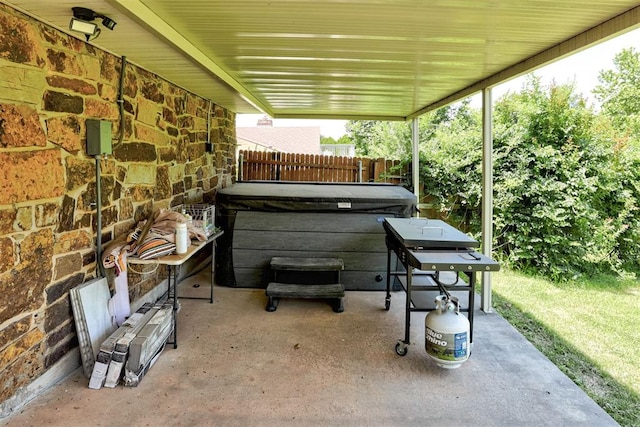 11129 E Thayer St, Midwest City, OK 73130 - view of patio / terrace featuring a hot tub