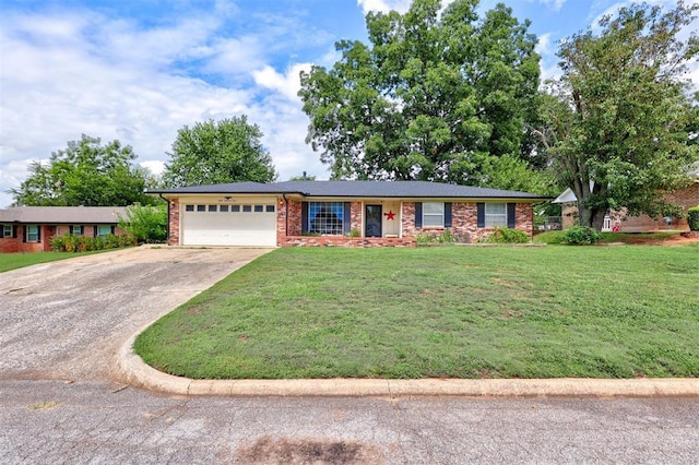801 Bonnie Ave, Purcell, OK 73080 - ranch-style home with a garage, concrete driveway, a front yard, and brick siding
