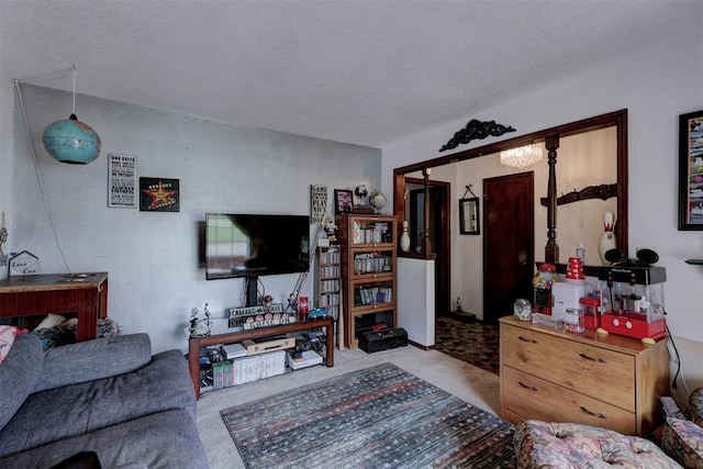 801 Bonnie Ave, Purcell, OK 73080 - carpeted living room with a textured ceiling