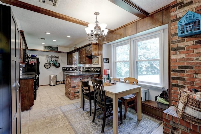 801 Bonnie Ave, Purcell, OK 73080 - dining space with a textured ceiling, a chandelier, light tile patterned flooring, ornamental molding, and recessed lighting