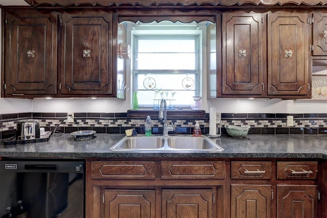 801 Bonnie Ave, Purcell, OK 73080 - kitchen with dishwasher, a sink, dark countertops, and backsplash