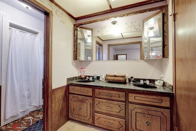 801 Bonnie Ave, Purcell, OK 73080 - full bath with double vanity, curtained shower, and wainscoting