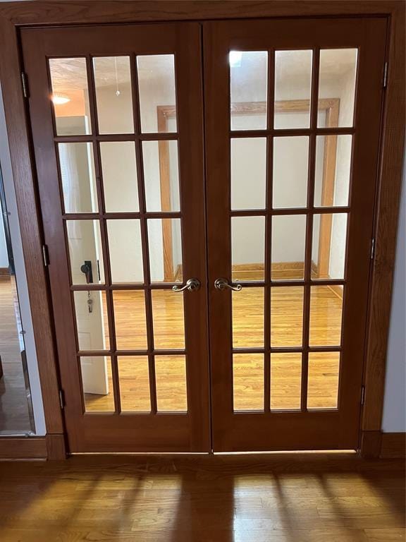 802 N Hudson St, Altus, OK 73521 - detailed view of french doors and wood finished floors