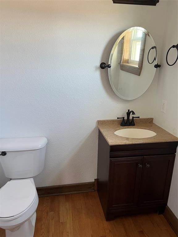802 N Hudson St, Altus, OK 73521 - half bath with vanity and wood finished floors