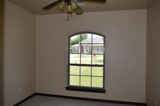 1713 Rain Tree Ln, Midwest City, OK 73130 - carpeted spare room featuring healthy amount of natural light, baseboards, and a ceiling fan