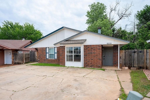 6225 SE 46th St, Oklahoma City, OK 73135 - view of front of property featuring brick siding and board and batten siding