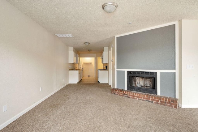 6225 SE 46th St, Oklahoma City, OK 73135 - unfurnished living room with carpet flooring, a fireplace, and a textured ceiling