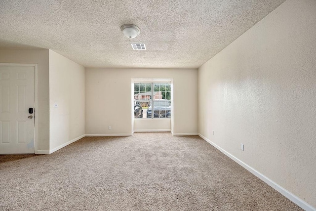 6225 SE 46th St, Oklahoma City, OK 73135 - carpeted spare room with a textured ceiling and a textured wall