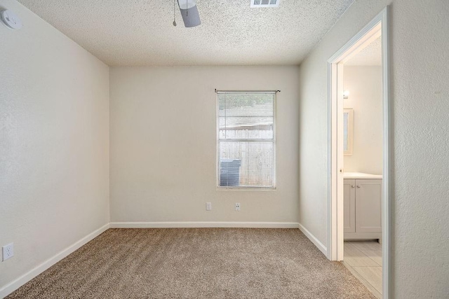 6225 SE 46th St, Oklahoma City, OK 73135 - unfurnished room featuring light carpet, a ceiling fan, a textured ceiling, and a smoke detector