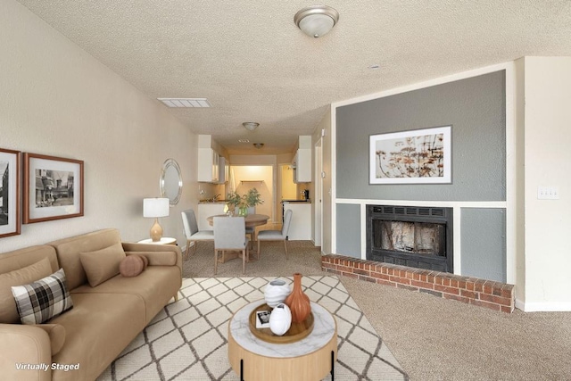 6225 SE 46th St, Oklahoma City, OK 73135 - living room featuring light colored carpet, a textured ceiling, and a brick fireplace