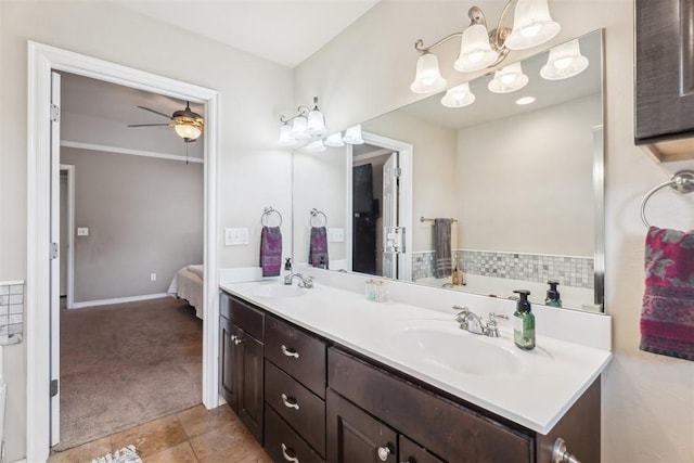 2303 Whispering Pine Blvd, Shawnee, OK 74804 - full bath with double vanity, a chandelier, ensuite bathroom, ceiling fan, and tile patterned flooring
