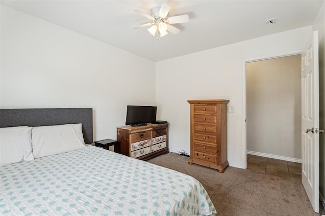 2303 Whispering Pine Blvd, Shawnee, OK 74804 - carpeted bedroom with a ceiling fan and baseboards