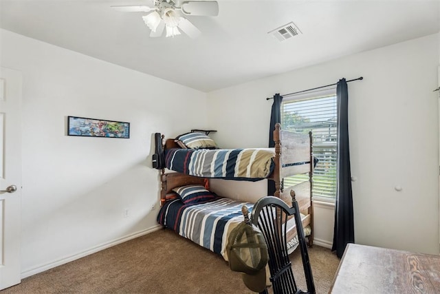 2303 Whispering Pine Blvd, Shawnee, OK 74804 - bedroom with light colored carpet and ceiling fan