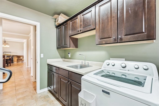 2303 Whispering Pine Blvd, Shawnee, OK 74804 - laundry room with washer / dryer, cabinet space, light tile patterned flooring, and a chandelier