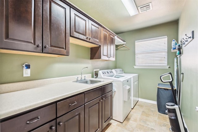 2303 Whispering Pine Blvd, Shawnee, OK 74804 - laundry area featuring cabinet space and independent washer and dryer