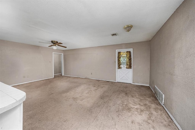 814 NW 48th St, Lawton, OK 73505 - carpeted empty room featuring a ceiling fan and baseboards