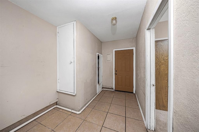 814 NW 48th St, Lawton, OK 73505 - corridor featuring light tile patterned floors and baseboards