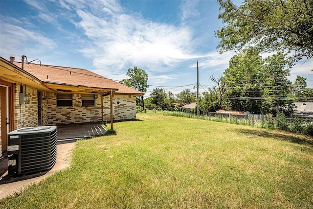 814 NW 48th St, Lawton, OK 73505 - view of green lawn featuring central AC unit and a patio