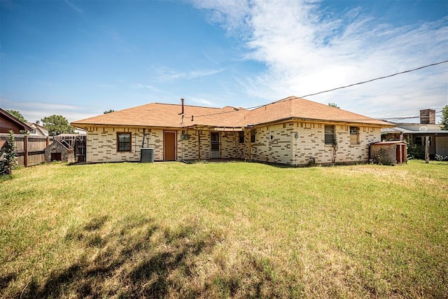 814 NW 48th St, Lawton, OK 73505 - back of house with brick siding and central AC unit