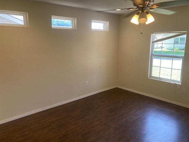 707 W Texas Ave, Anadarko, OK 73005 - empty room featuring baseboards, dark wood-style floors, and ceiling fan