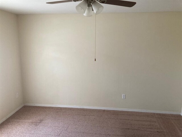 707 W Texas Ave, Anadarko, OK 73005 - carpeted spare room featuring a ceiling fan and baseboards