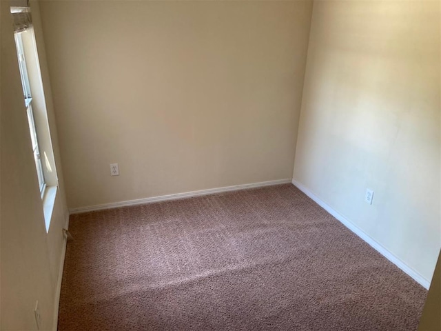 707 W Texas Ave, Anadarko, OK 73005 - carpeted empty room with baseboards