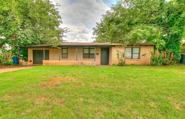 824 E Rose Dr, Midwest City, OK 73110 - ranch-style house featuring concrete driveway, brick siding, a front yard, and a garage
