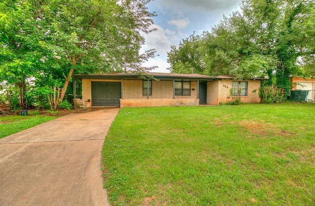824 E Rose Dr, Midwest City, OK 73110 - single story home featuring brick siding, an attached garage, driveway, and a front lawn