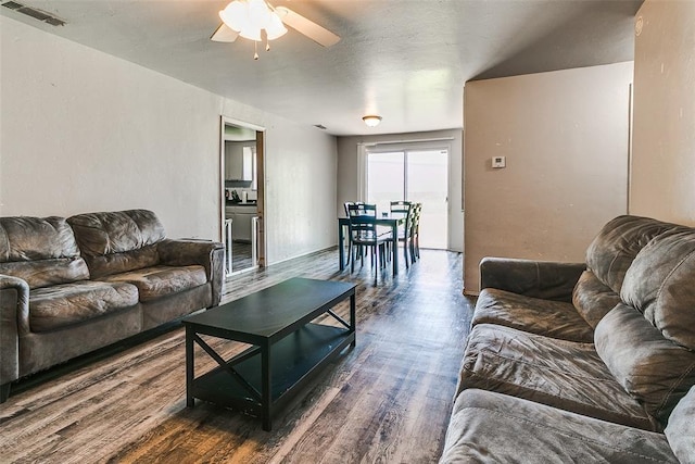 824 E Rose Dr, Midwest City, OK 73110 - living area with dark wood-style floors and ceiling fan