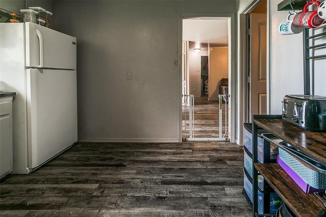 824 E Rose Dr, Midwest City, OK 73110 - kitchen with freestanding refrigerator and dark wood-style flooring
