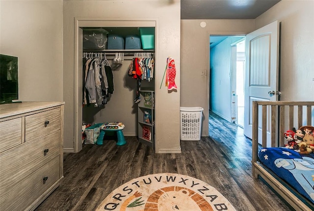 824 E Rose Dr, Midwest City, OK 73110 - bedroom featuring dark wood finished floors and a closet