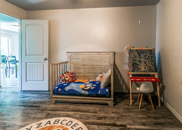 824 E Rose Dr, Midwest City, OK 73110 - bedroom with wood finished floors and baseboards
