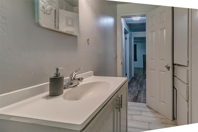 824 E Rose Dr, Midwest City, OK 73110 - bathroom with vanity and a textured wall