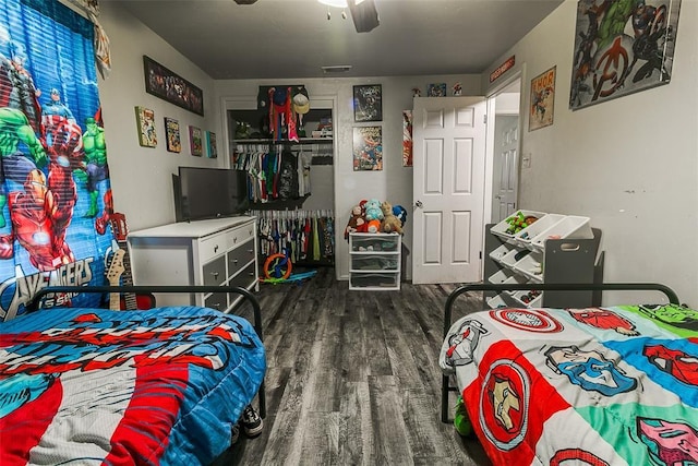 824 E Rose Dr, Midwest City, OK 73110 - bedroom with wood finished floors and ceiling fan