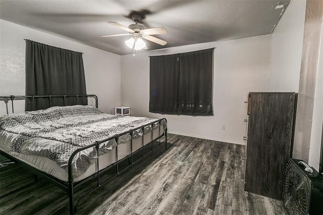 824 E Rose Dr, Midwest City, OK 73110 - bedroom with wood finished floors and ceiling fan