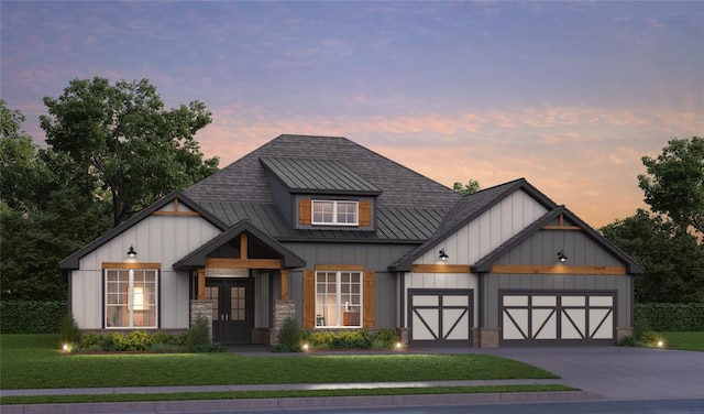 10165 NW 100th St, Yukon, OK 73099 - modern inspired farmhouse with board and batten siding, an attached garage, a yard, concrete driveway, and a standing seam roof