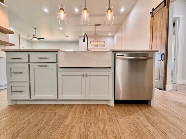 10165 NW 100th St, Yukon, OK 73099 - kitchen featuring dishwasher, a barn door, hanging light fixtures, ceiling fan, and recessed lighting