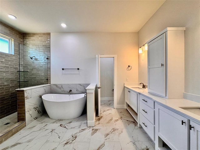 10165 NW 100th St, Yukon, OK 73099 - full bath featuring double vanity, tiled shower, a soaking tub, marble finish floors, and recessed lighting