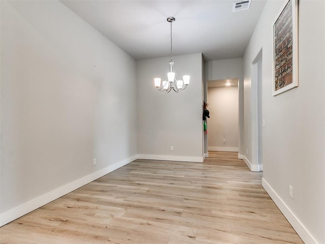 5512 Cheyenne Rd, Warr Acres, OK 73132 - unfurnished dining area with a chandelier and light wood finished floors