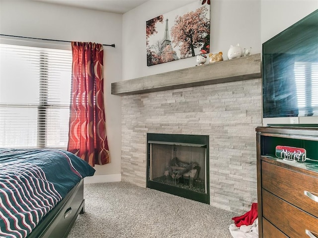 5512 Cheyenne Rd, Warr Acres, OK 73132 - carpeted bedroom featuring a fireplace and baseboards