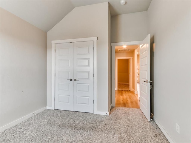 5512 Cheyenne Rd, Warr Acres, OK 73132 - unfurnished bedroom with carpet, a closet, and lofted ceiling