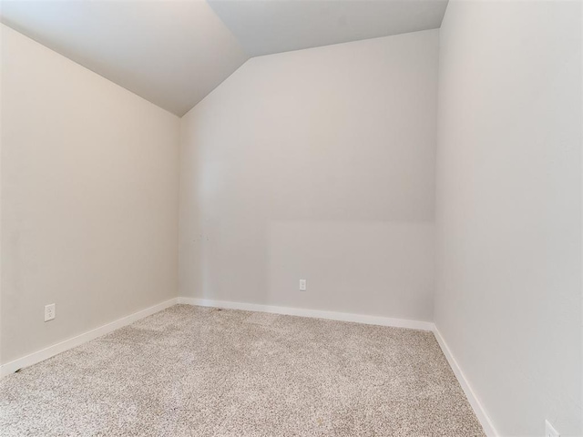 5512 Cheyenne Rd, Warr Acres, OK 73132 - spare room featuring carpet and vaulted ceiling