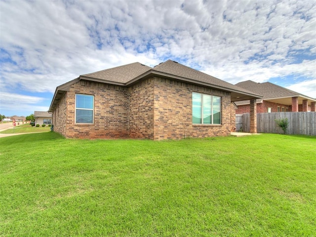 5512 Cheyenne Rd, Warr Acres, OK 73132 - view of side of home with brick siding and a shingled roof
