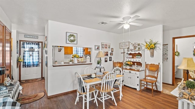 677 S Morgan Ave, Blanchard, OK 73010 - dining space featuring a ceiling fan, wood finished floors, and a textured ceiling