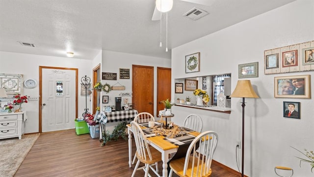 677 S Morgan Ave, Blanchard, OK 73010 - dining room featuring wood finished floors, a ceiling fan, and a textured ceiling