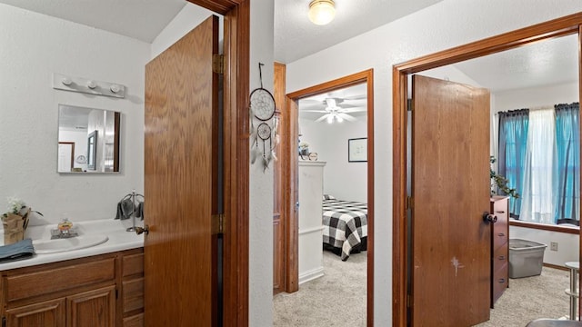 677 S Morgan Ave, Blanchard, OK 73010 - bathroom with vanity, ceiling fan, and a textured wall