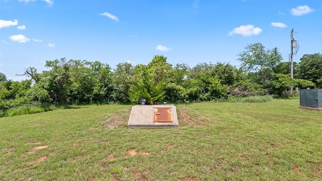 677 S Morgan Ave, Blanchard, OK 73010 - entry to storm shelter with a yard